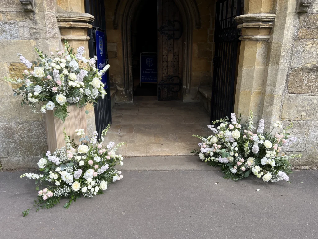 Meadow floral displays at the entrance of St Edward's Church