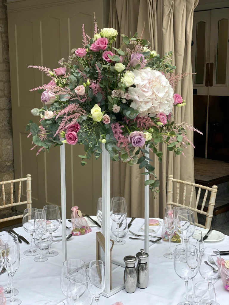 Ellenborough Park 4 Cotswold Blooms is a luxury wedding florist in Cheltenham and the Cotswolds, creating refined, bespoke floral designs using seasonal British flowers. Table centrepiece wedding flowers Ellenborough Park Cheltenham