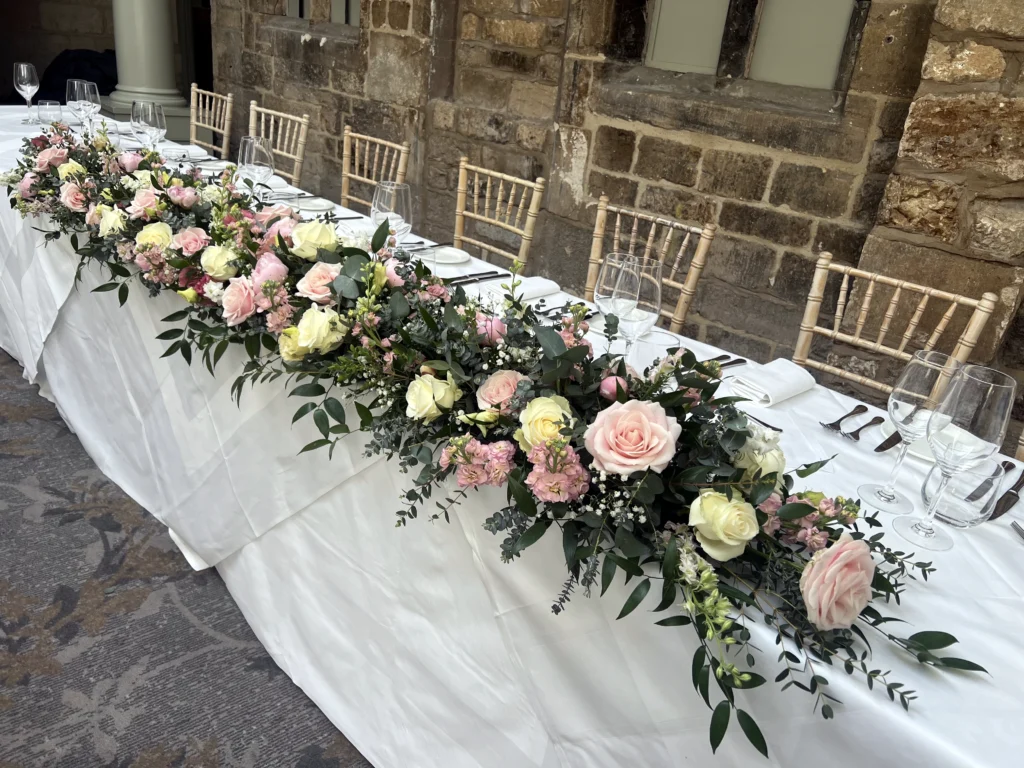 Ellenborough Park 12 Cotswold Blooms is a luxury wedding florist in Cheltenham and the Cotswolds, creating refined, bespoke floral designs using seasonal British flowers. Table centrepiece wedding flowers Ellenborough Park Cheltenham