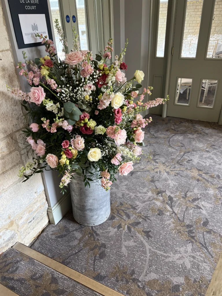 Ellenborough Park 14 Cotswold Blooms is a luxury wedding florist in Cheltenham and the Cotswolds, creating refined, bespoke floral designs using seasonal British flowers. Luxury floral arrangement Ellenborough Park manor house wedding