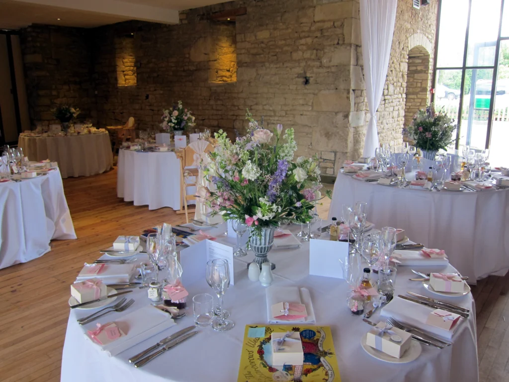 Table centrepiece wedding flowers Great Tythe Barn Tetbury