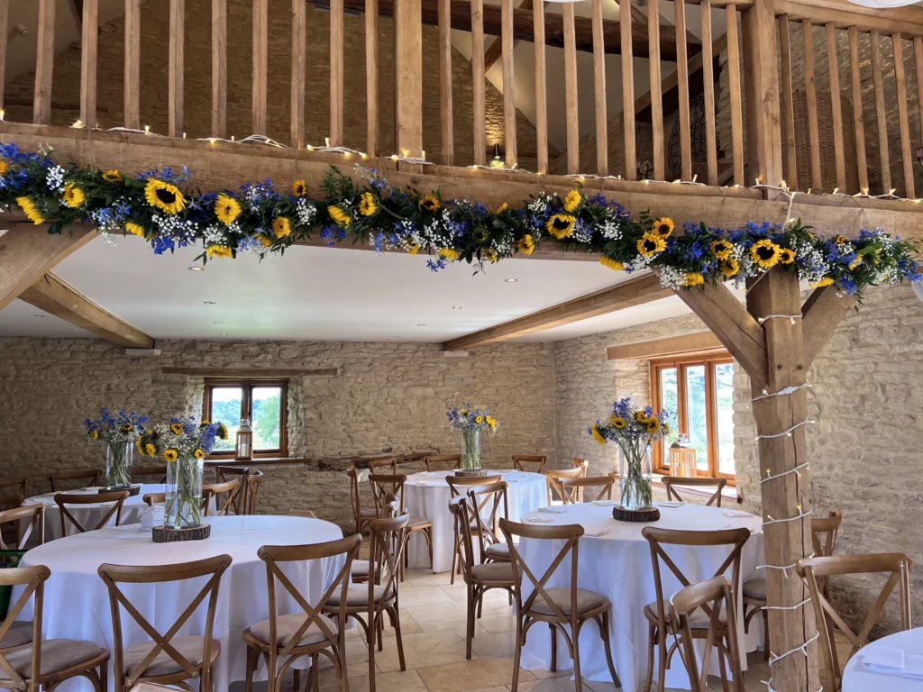 Luxury wedding floral design at Kingscote Barn by Cotswold Blooms