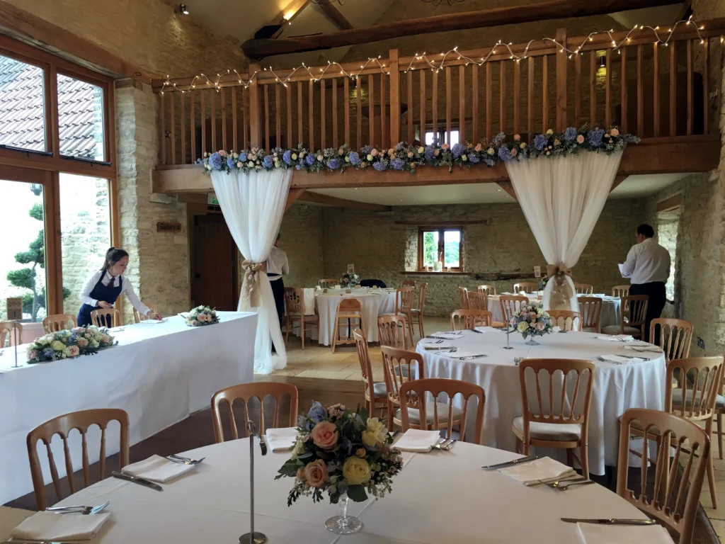 Luxury wedding floristry at Kingscote Barn, Gloucestershire