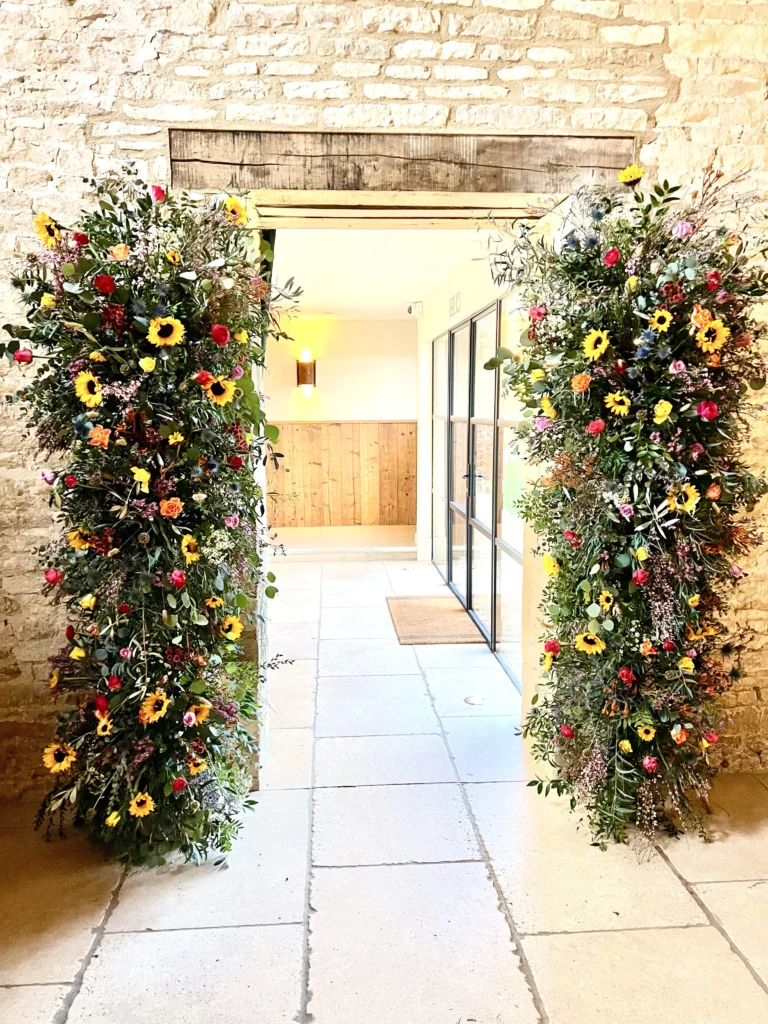 Statement floral installation Old Gore Barn courtyard Cotswolds