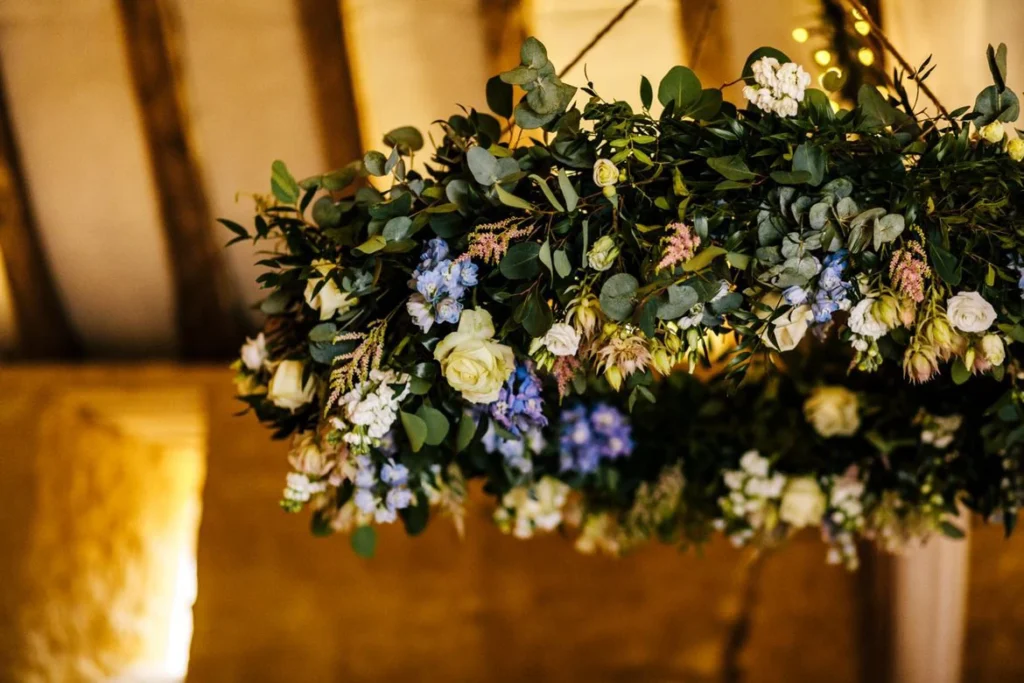 Rustic-style floral halo display at Owlpen Manor