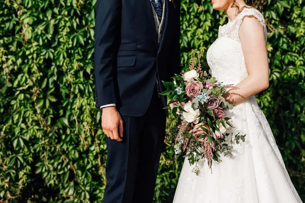 Dusty pink and white teardrop bouquet at Oxleaze Barn