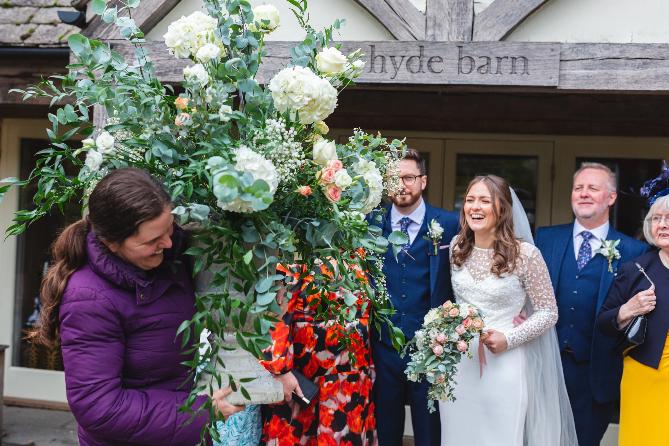 Laura McLellan, founder of Cotswold Blooms, holding a large urn display