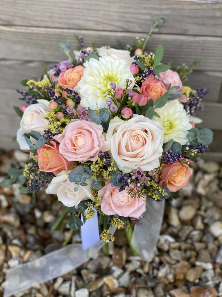 Textured bridal bouquet with mixed pink roses, white dahlia, eucalyptus and dried lavender