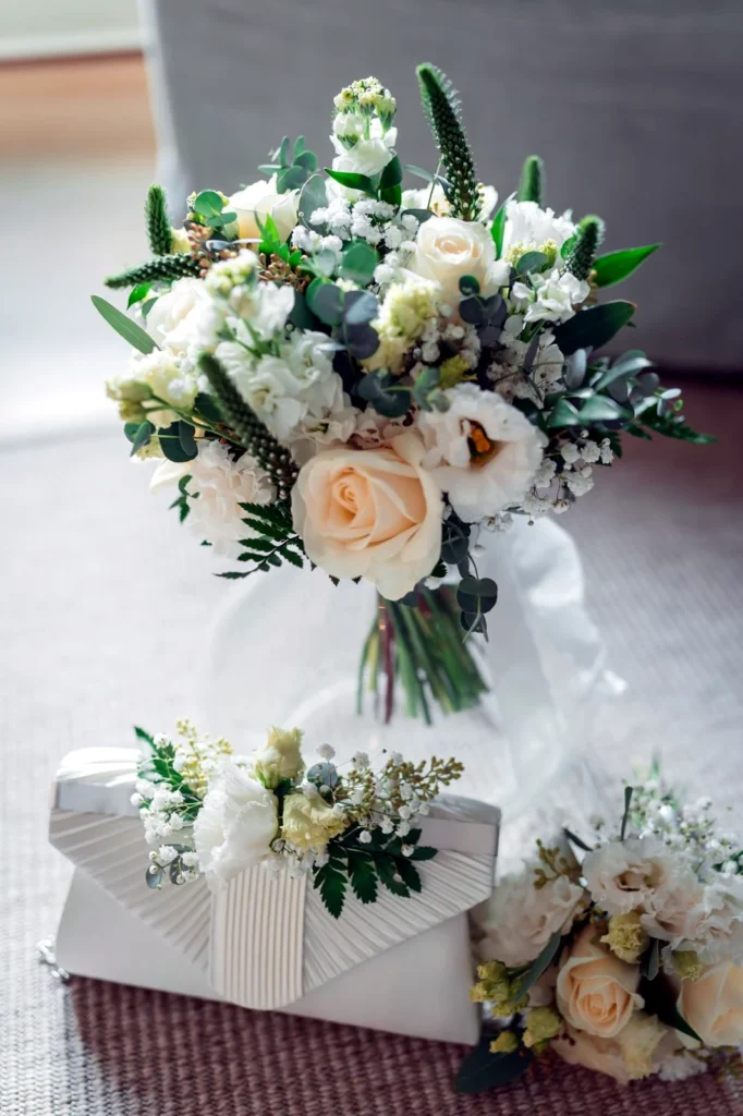 Bridal bouquet, handbag display and flower girl posy for a wedding at The Old Gore