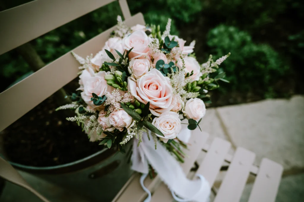Wedding bouquet in light pink tones with natural foliage